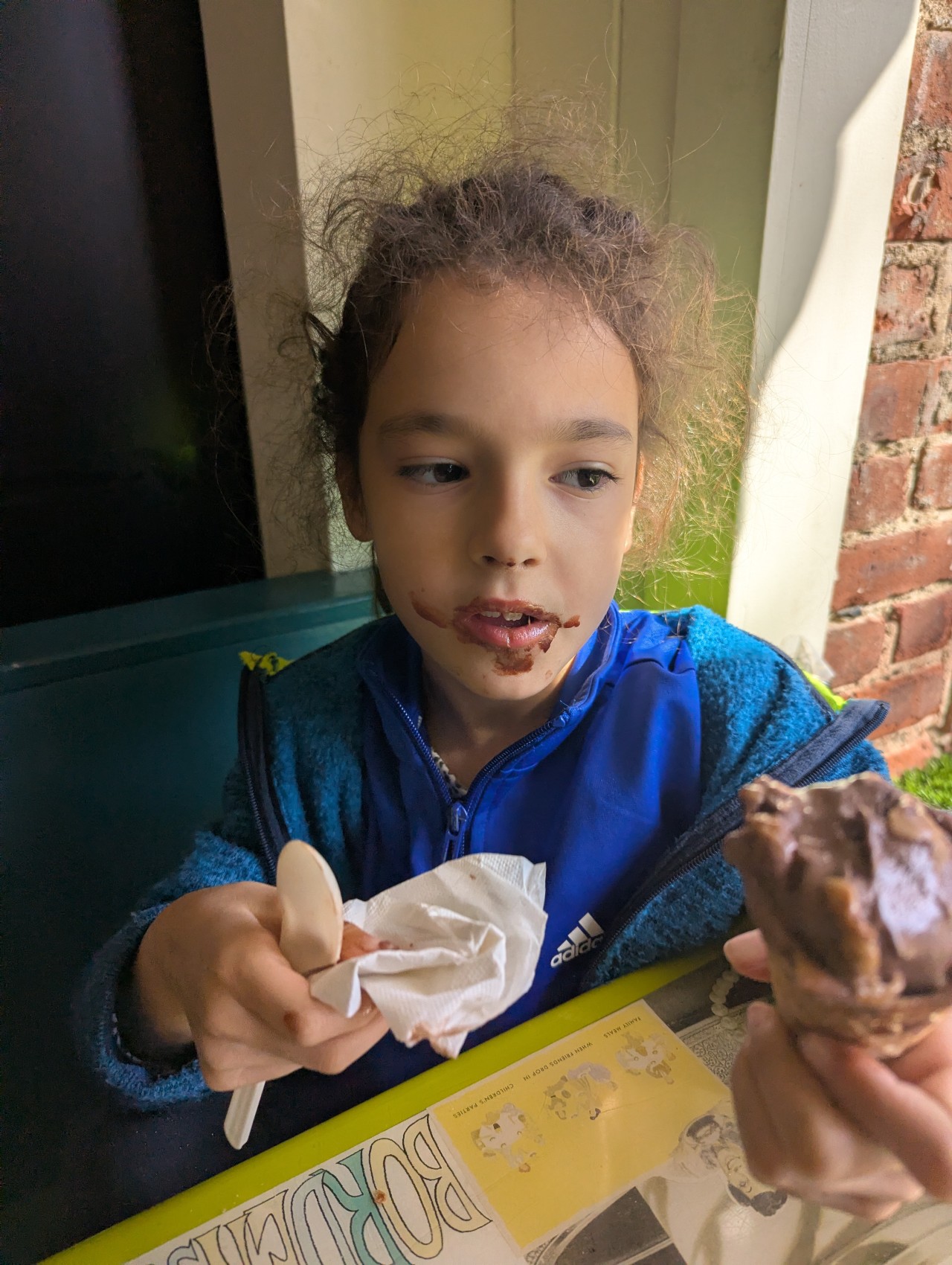 Elena — chocolate evidence around her mouth